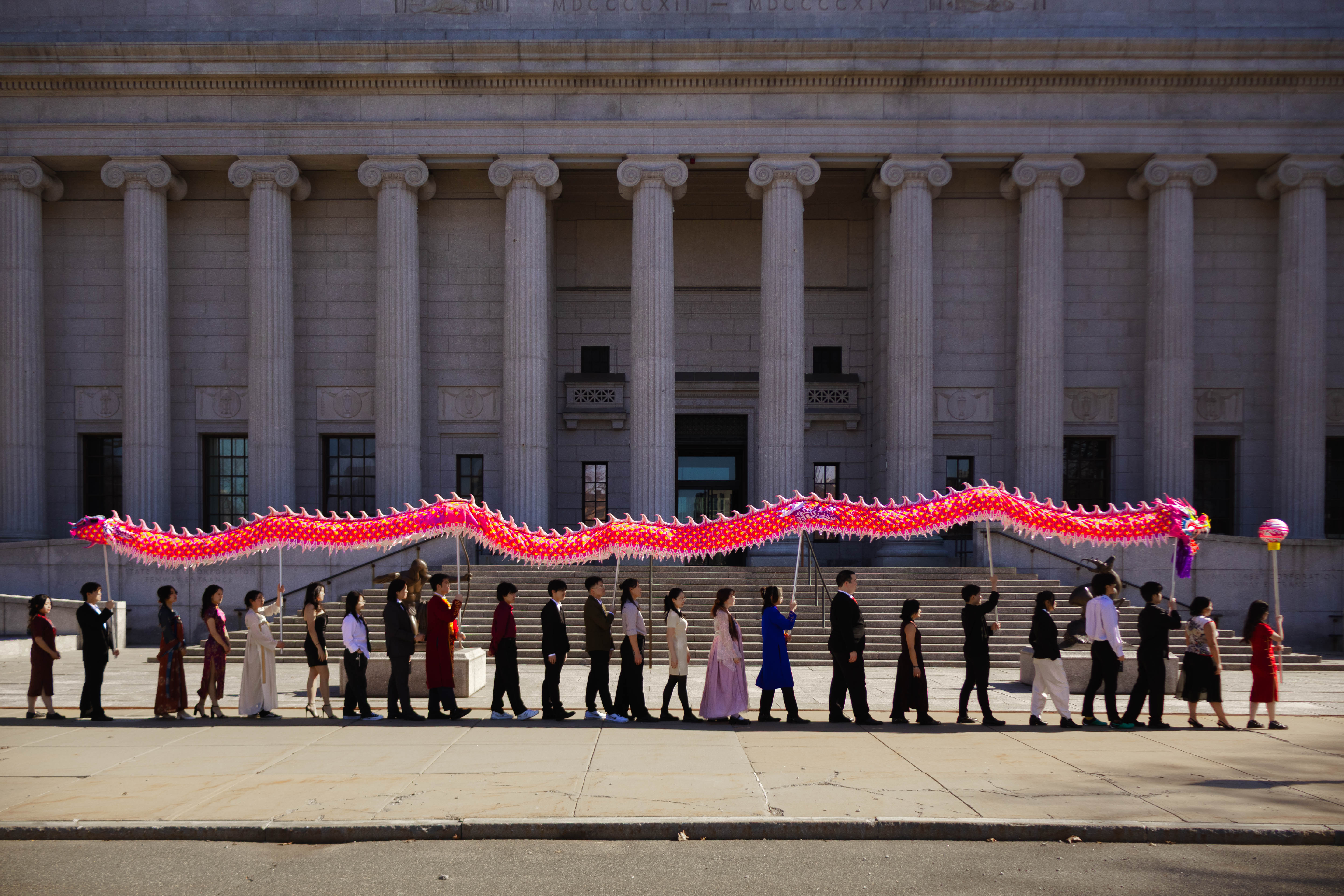 The Northeastern University Dragon and Lion Dance Troupe in a circle pose