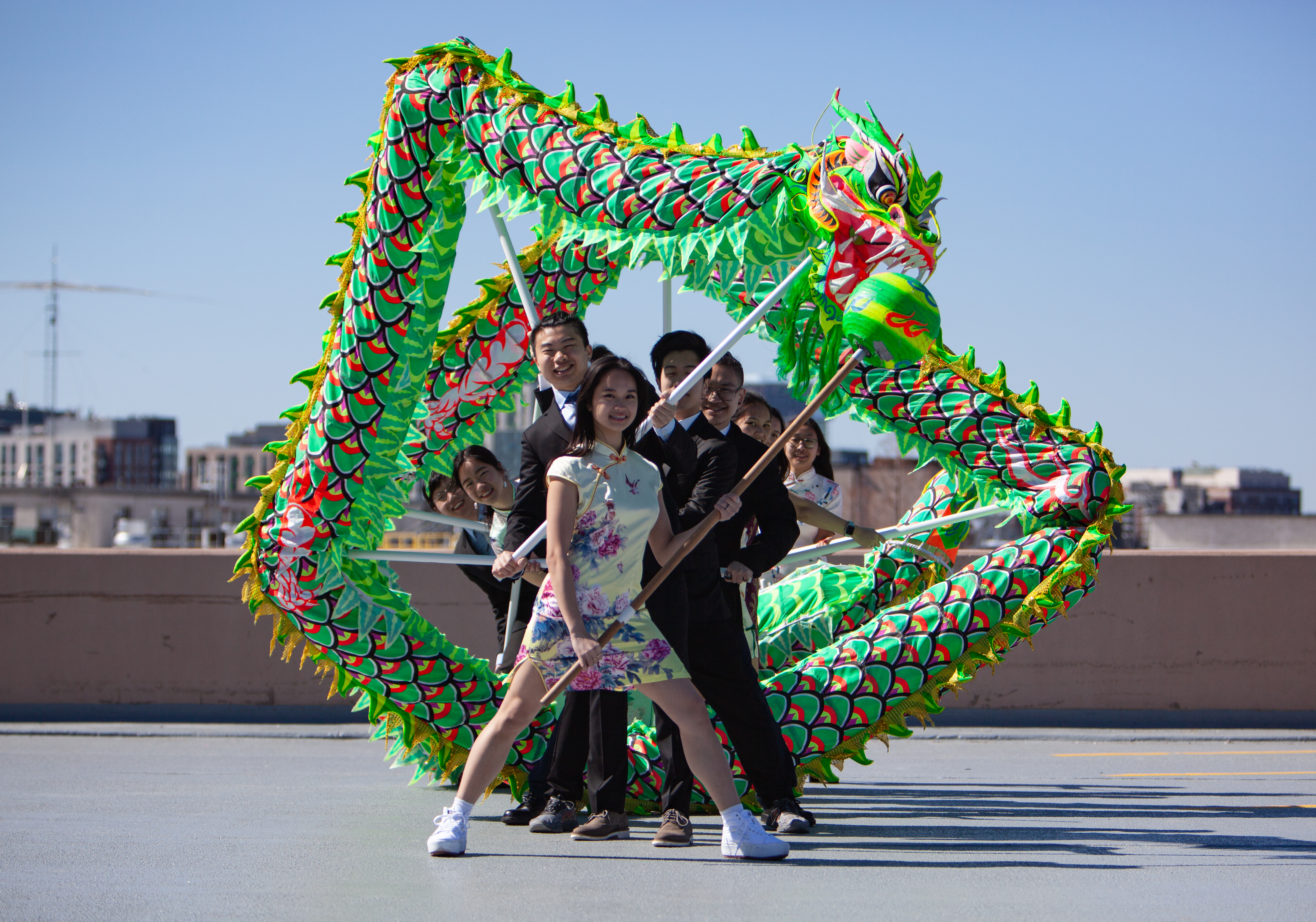 The Northeastern University Dragon and Lion Dance Troupe in a circle pose